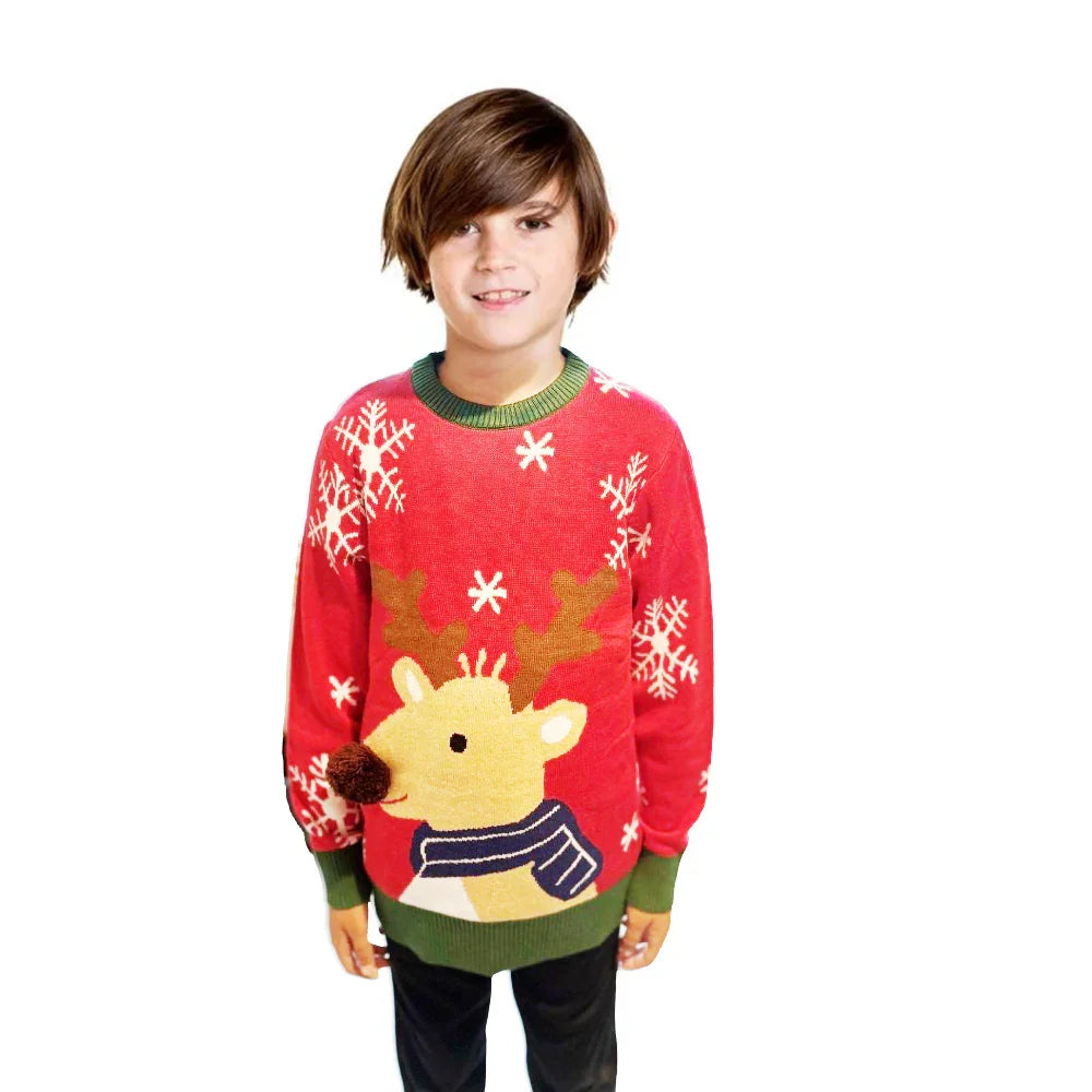 Boy in red Christmas reindeer sweater with snowflake design on white background