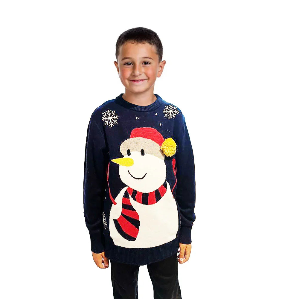 Boy wearing navy blue Christmas sweater with snowman and snowflake design on white background
