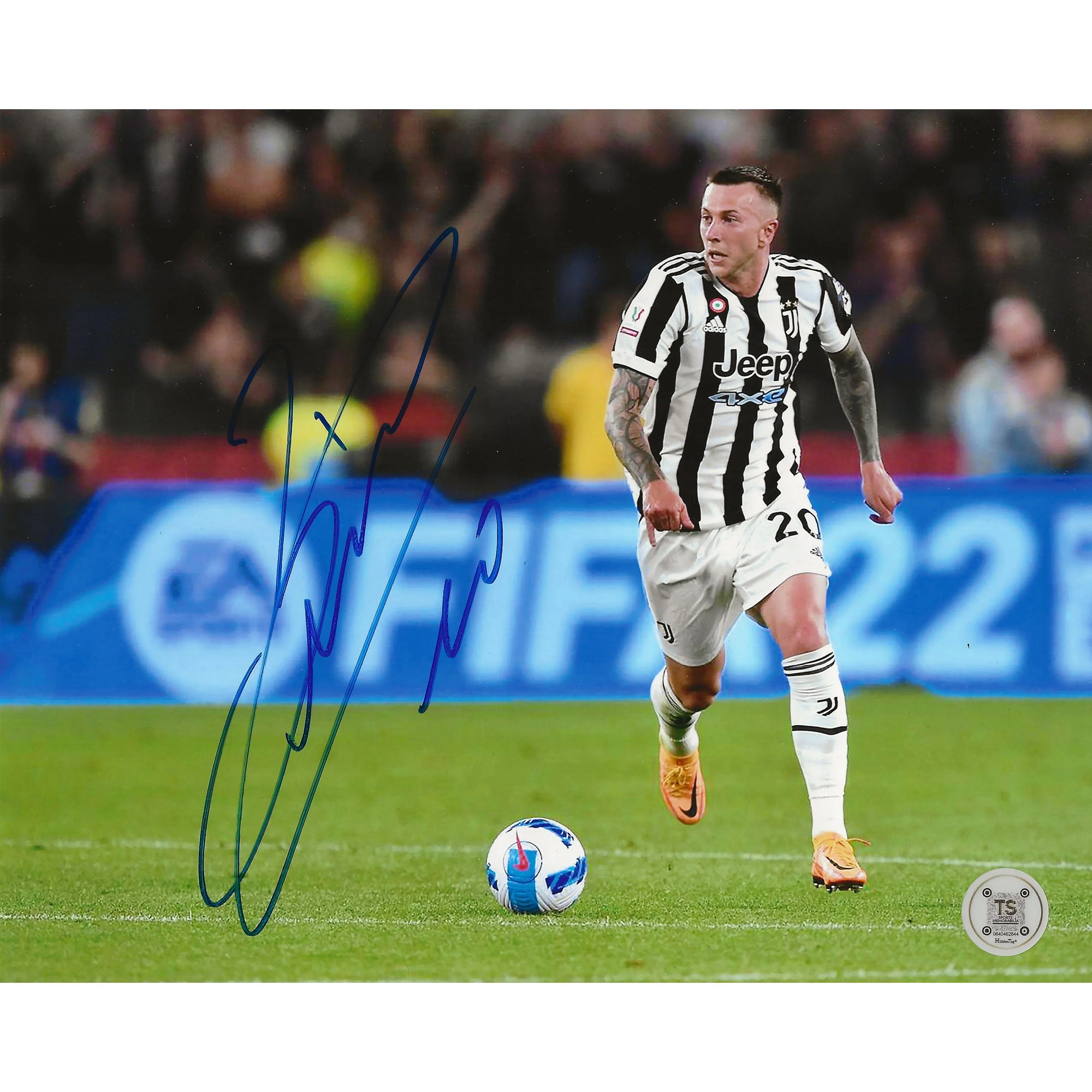 Juventus soccer player in black and white kit running with ball on field, signed photo