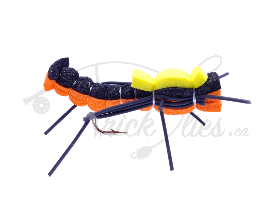 Black and orange foam hopper fishing fly with yellow top and rubber legs