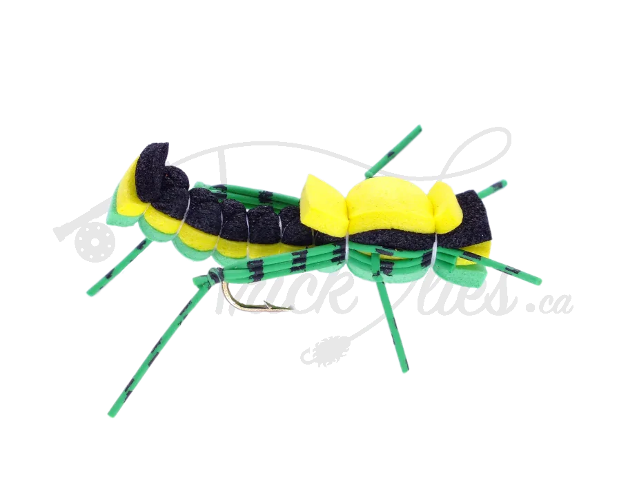 Green and yellow foam grasshopper fishing fly with segmented body and striped legs