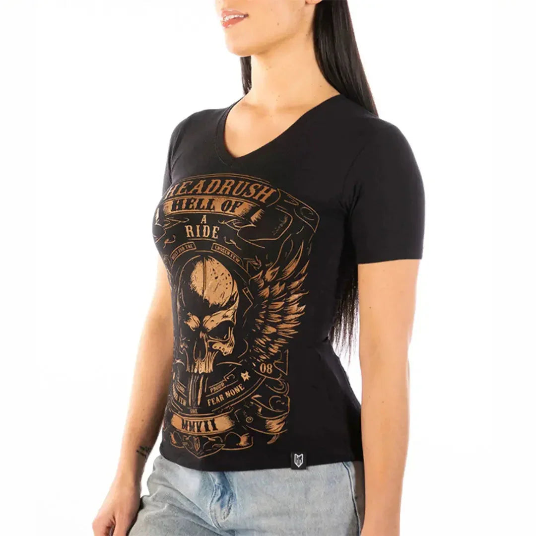 Woman wearing black vintage V-neck T-shirt with skull and wing graphic, casual style
