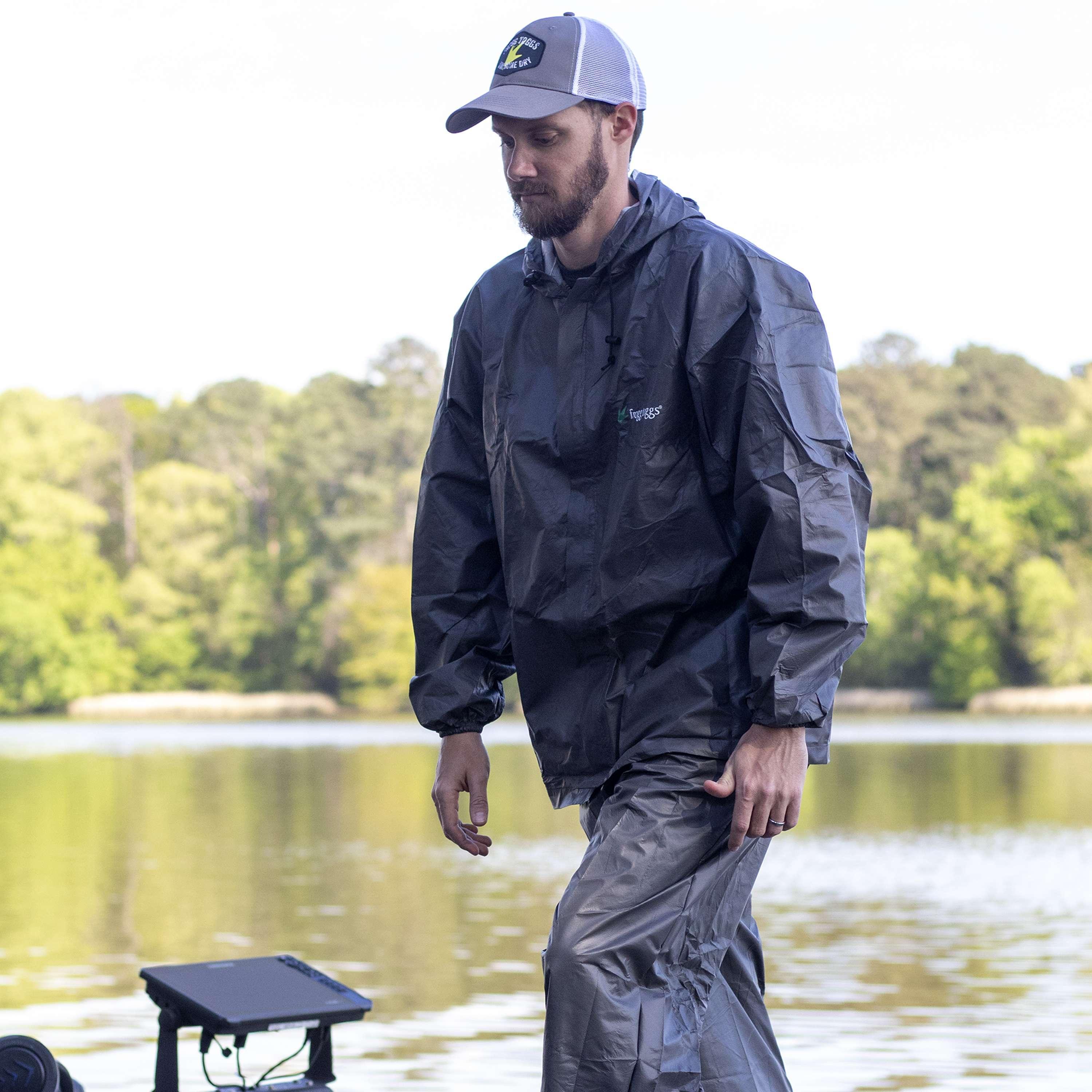 Man wearing Frogg Toggs Ultra-Lite2 waterproof rain suit by a lake outdoors