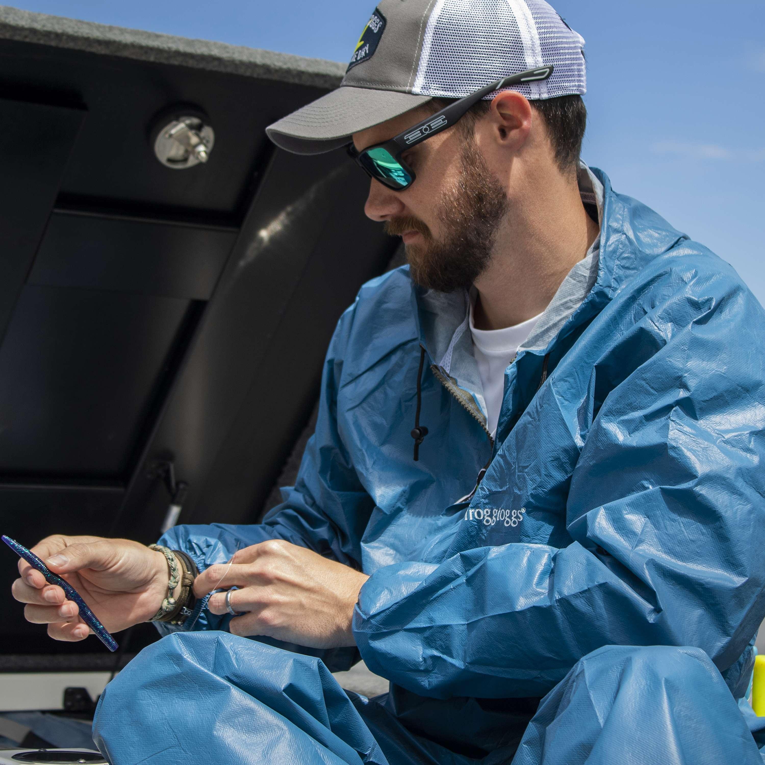 Man wearing Frogg Toggs Ultra-Lite2 blue waterproof rain suit outdoors