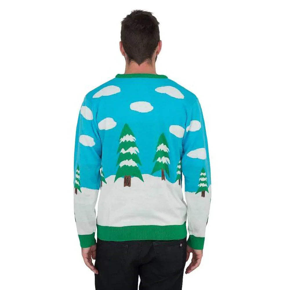 Man wearing blue ugly Christmas sweater with snowy trees and clouds on the back