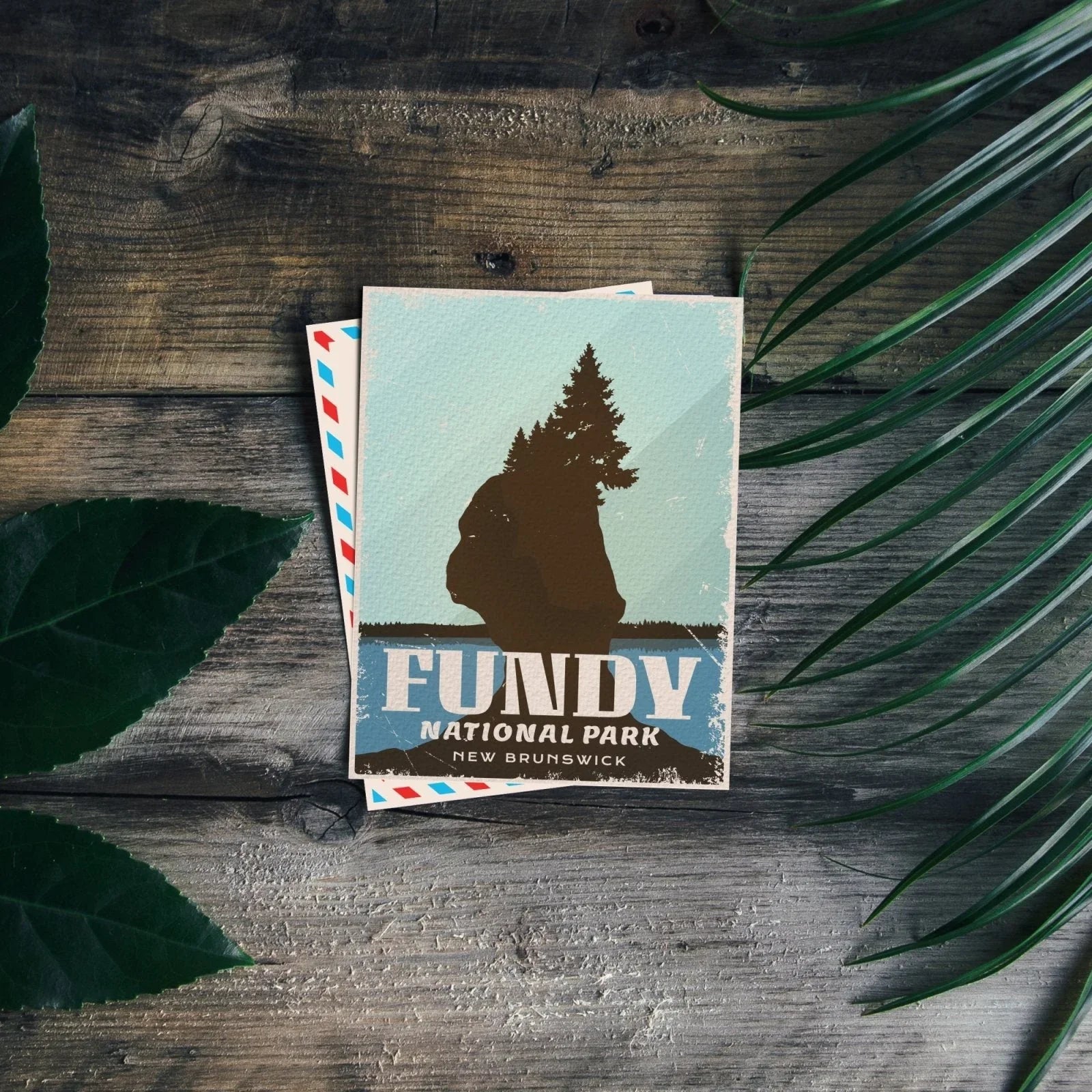 Fundy National Park postcard on rustic wood with leaf and palm, New Brunswick travel souvenir