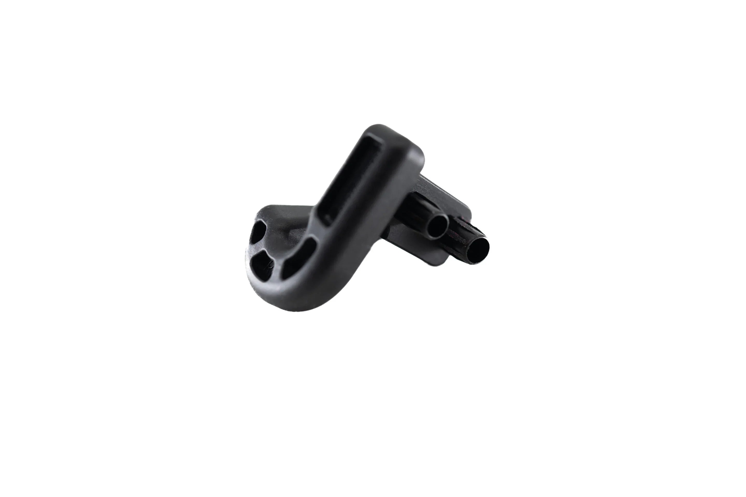 Black plastic bike accessory part with tube slots on a white background