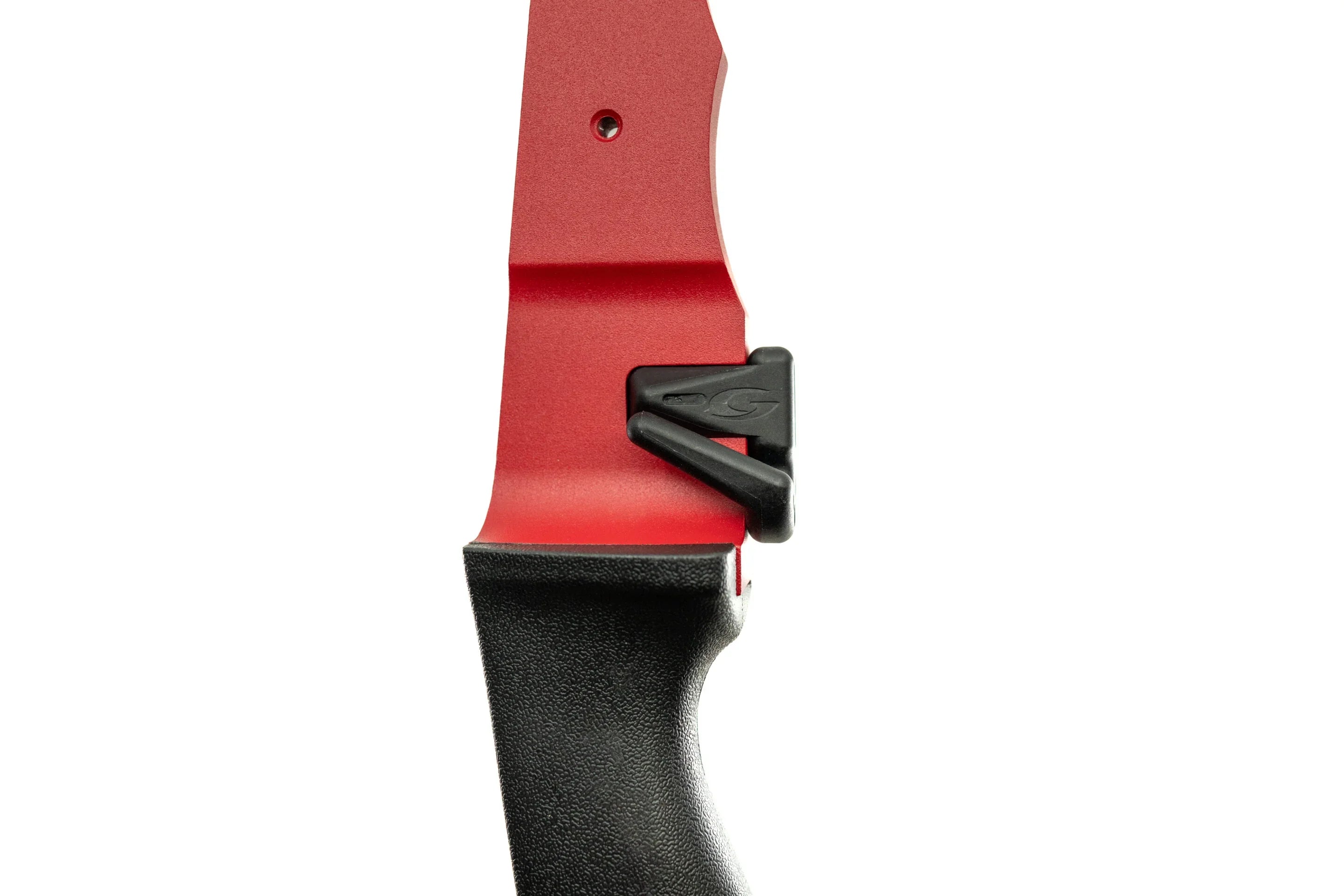 Close-up of a red archery riser with black grip and arrow rest on white background