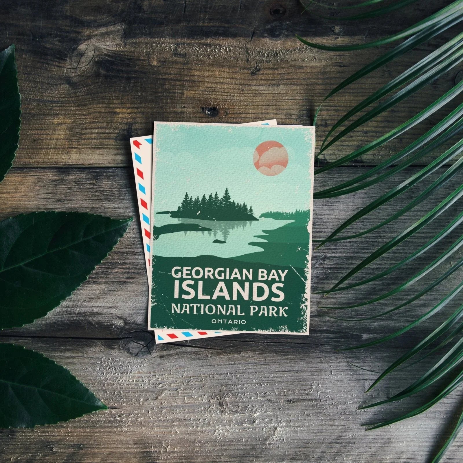Georgian Bay Islands National Park Ontario postcard on rustic wood with green leaves
