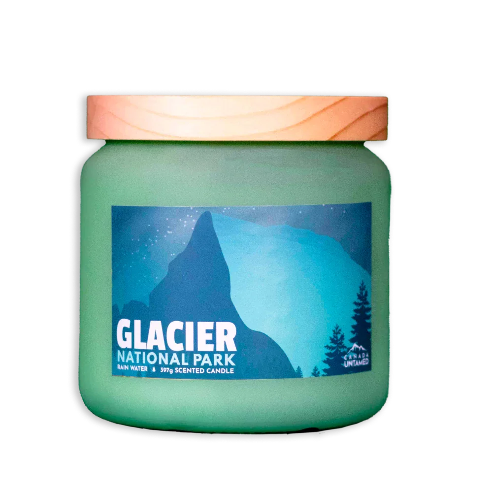 Glacier National Park rain water scented candle in frosted green jar with mountain label