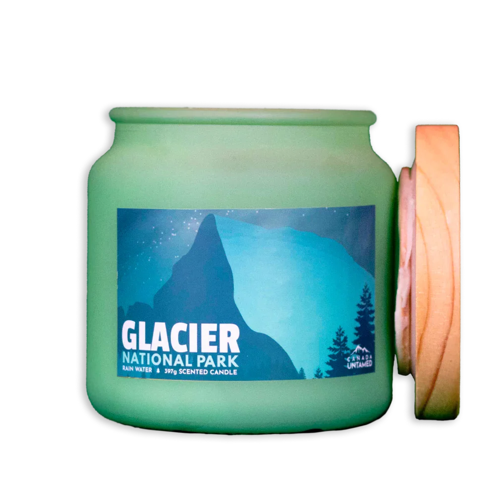 Glacier National Park rain water scented candle in green frosted jar with wooden lid