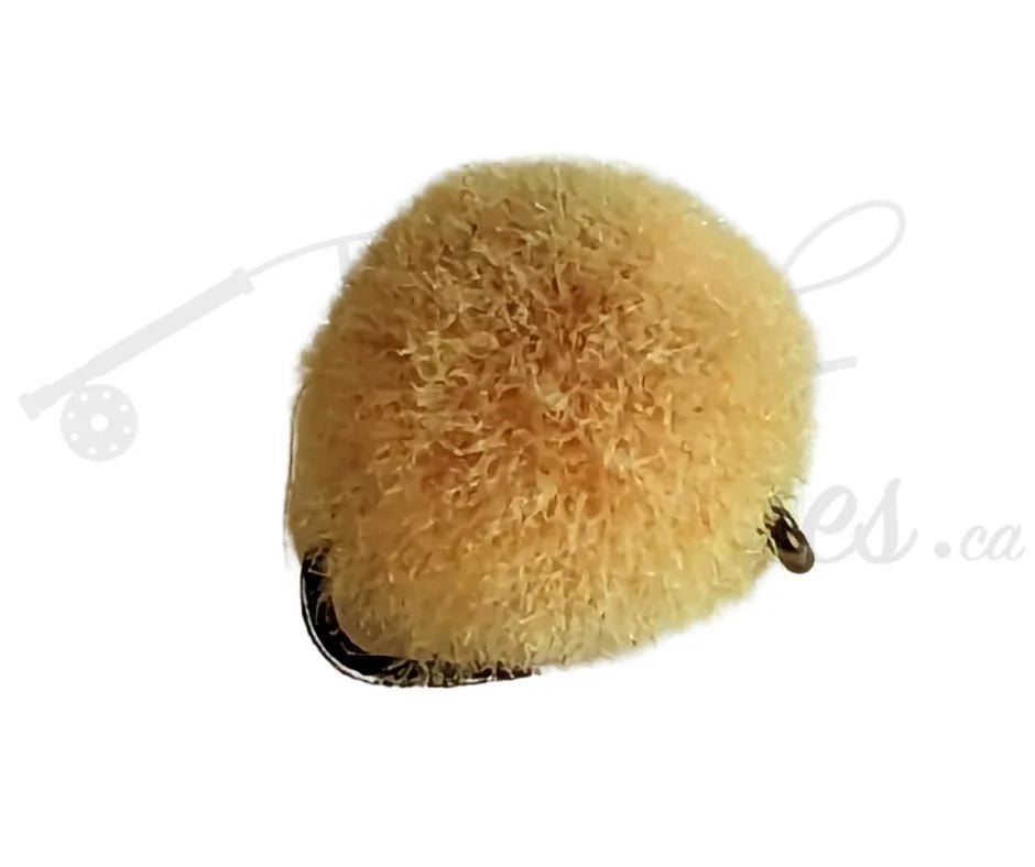 Glowbug egg peach fly fishing lure with fluffy peach material on hook