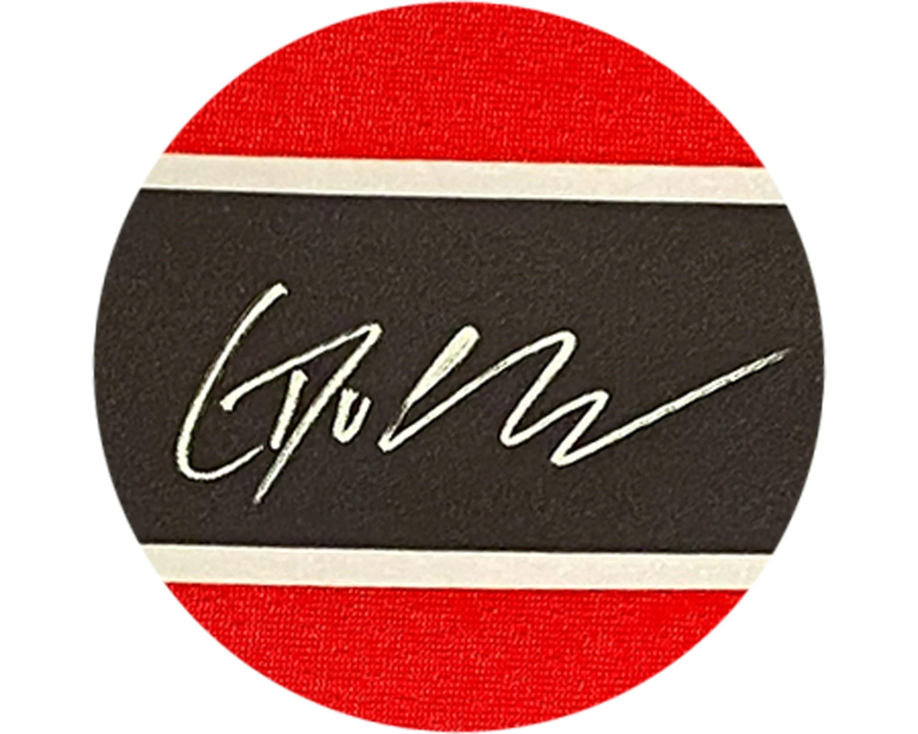 White signature on black and red background with a white stripe, close-up detail.
