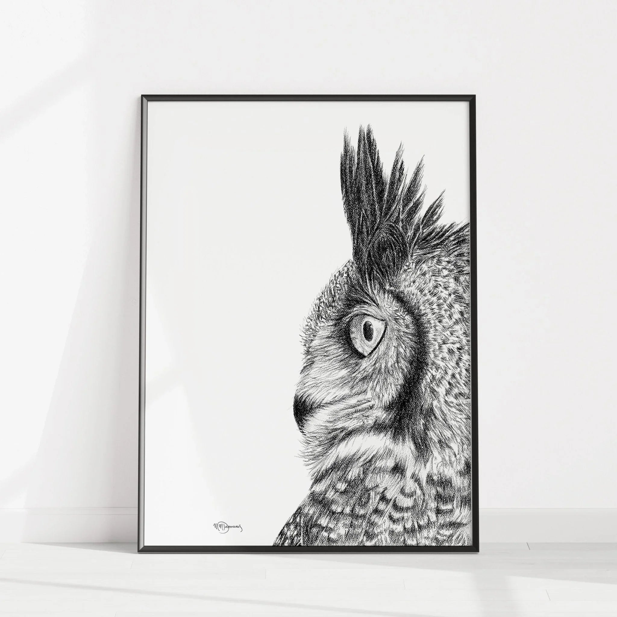 Black and white great horned owl illustration in a modern frame on a white wall