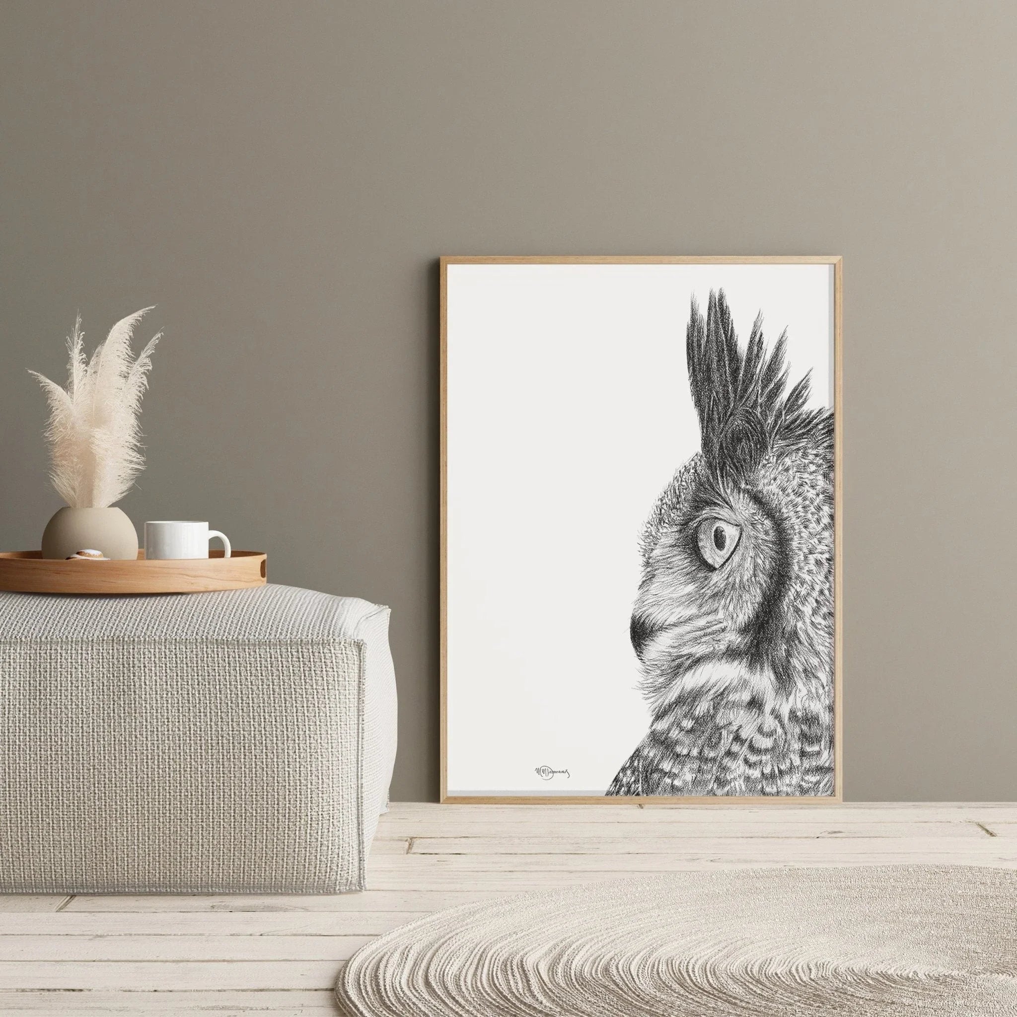 Minimalist interior with framed great horned owl sketch, pampas vase, neutral decor