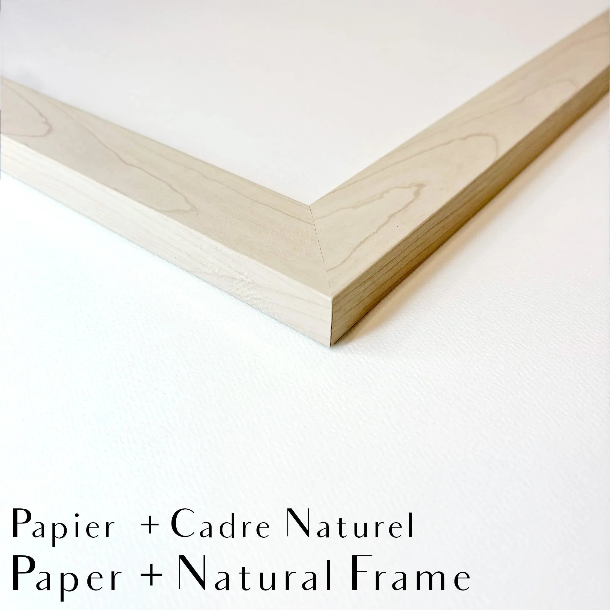 Close-up of light wood natural picture frame corner on white background, paper and natural frame