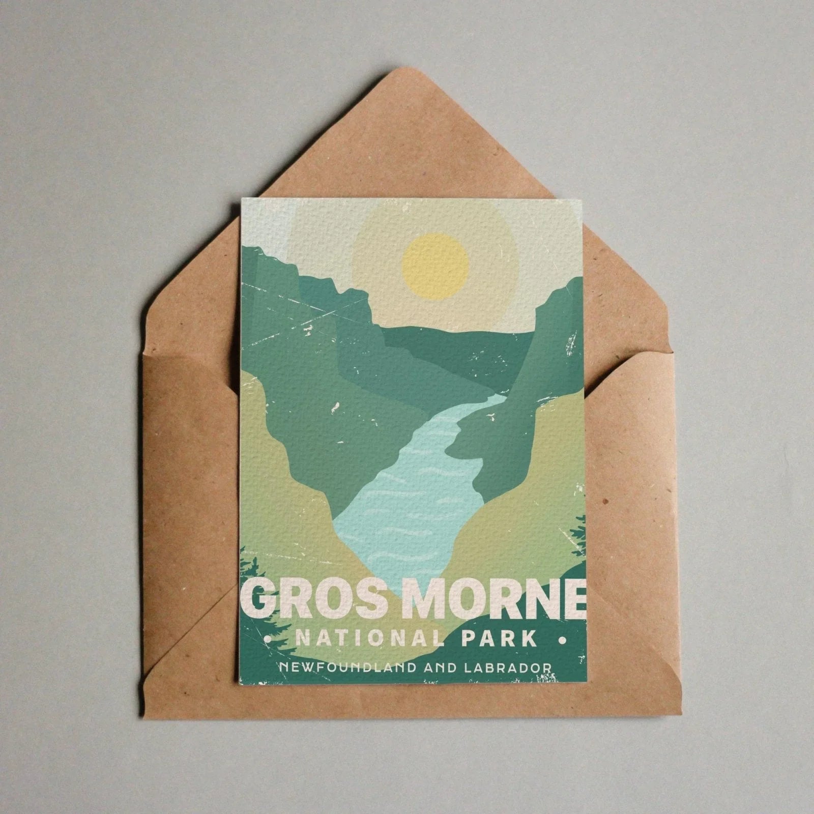 Gros Morne National Park postcard with stylized mountains, river, and sun in envelope