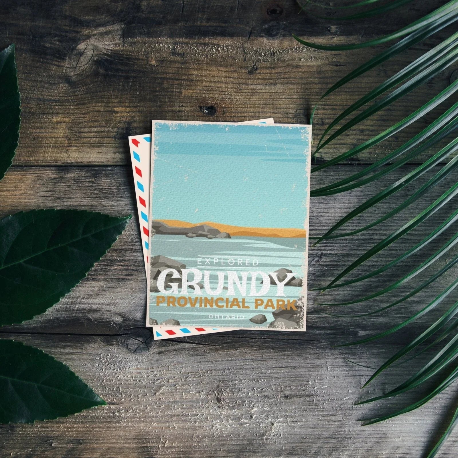 Grundy Lake Provincial Park Ontario postcard on rustic wood with green leaves