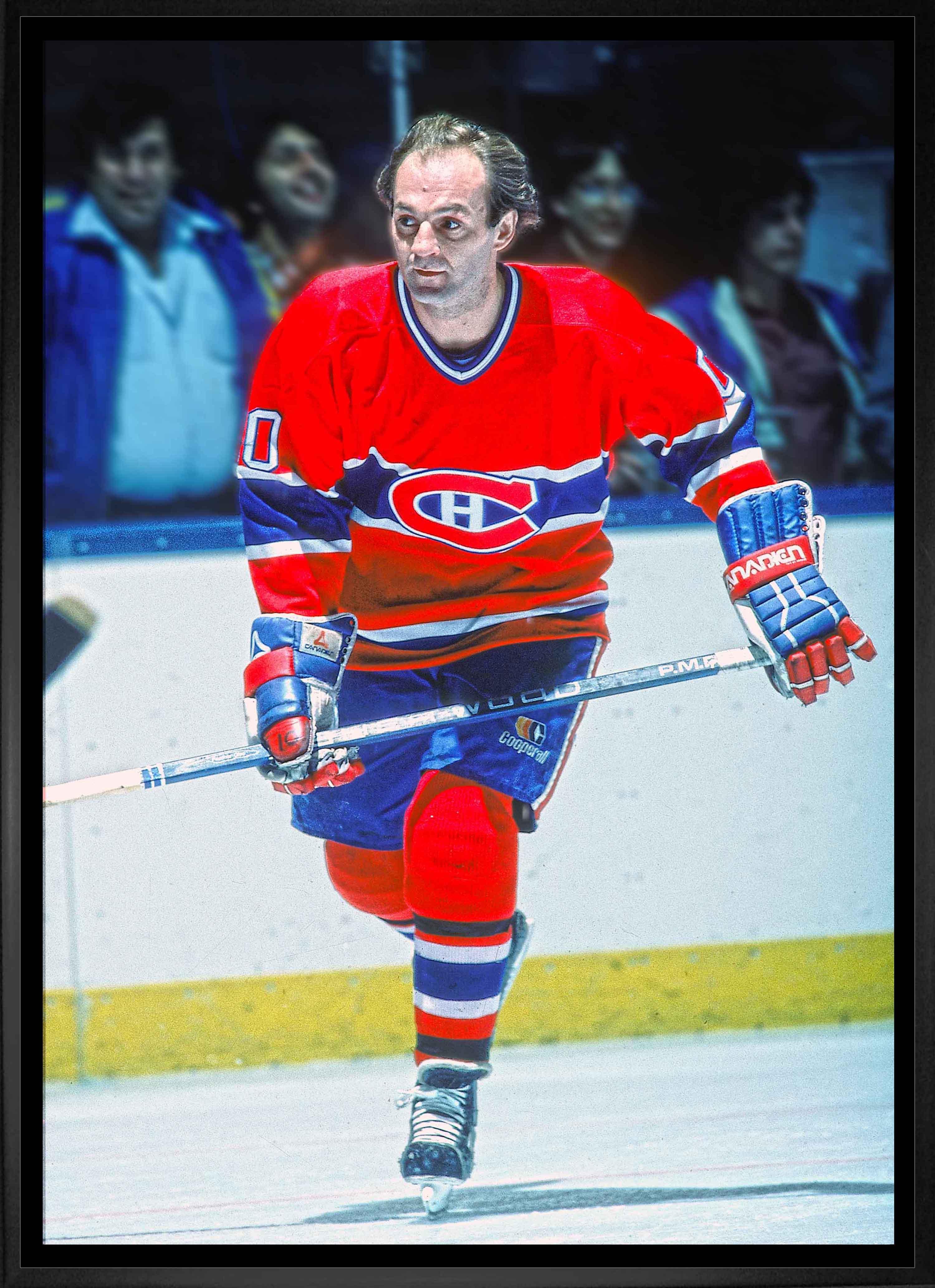 Hockey player in red Montreal Canadiens jersey skating on ice during a game