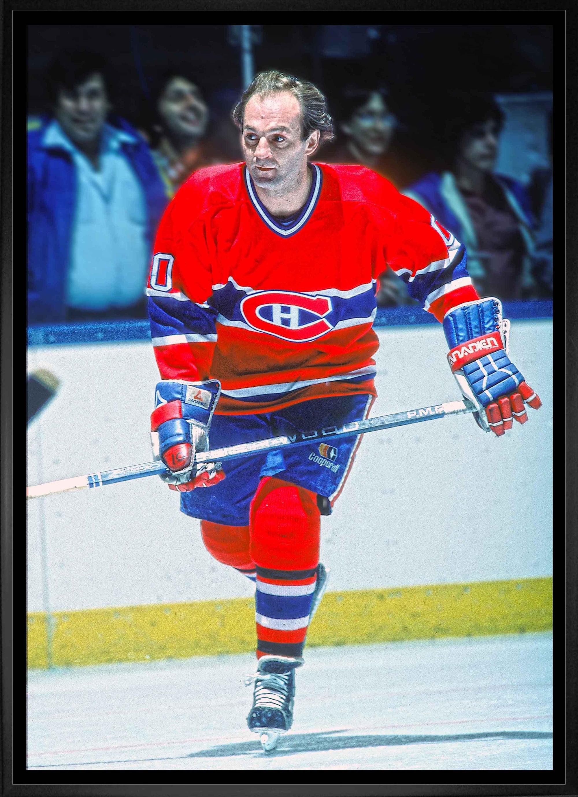 Hockey player in red Montreal Canadiens jersey skating on ice during a game