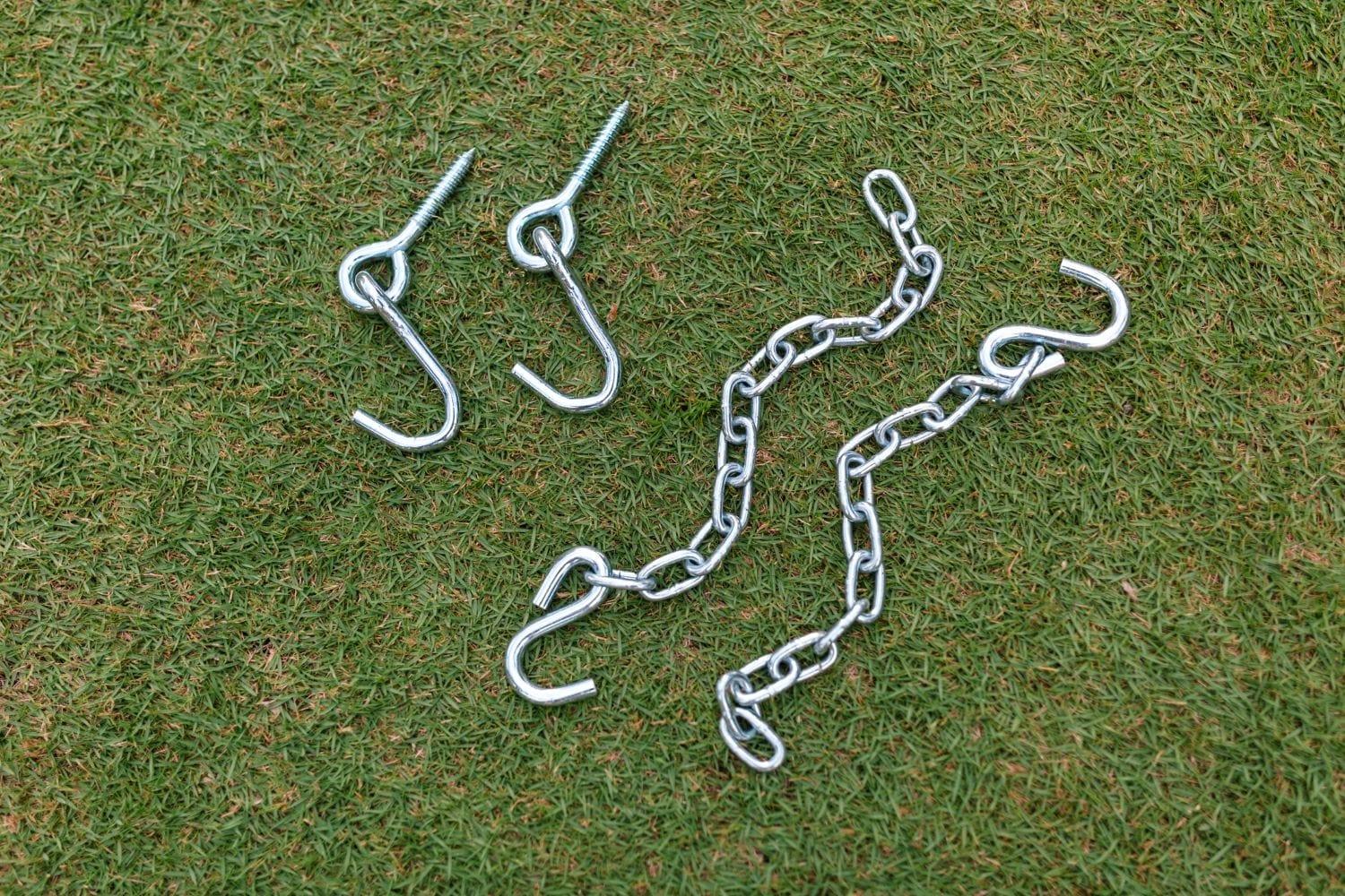 Hammock hanging chain kit with hooks and metal chains on green grass