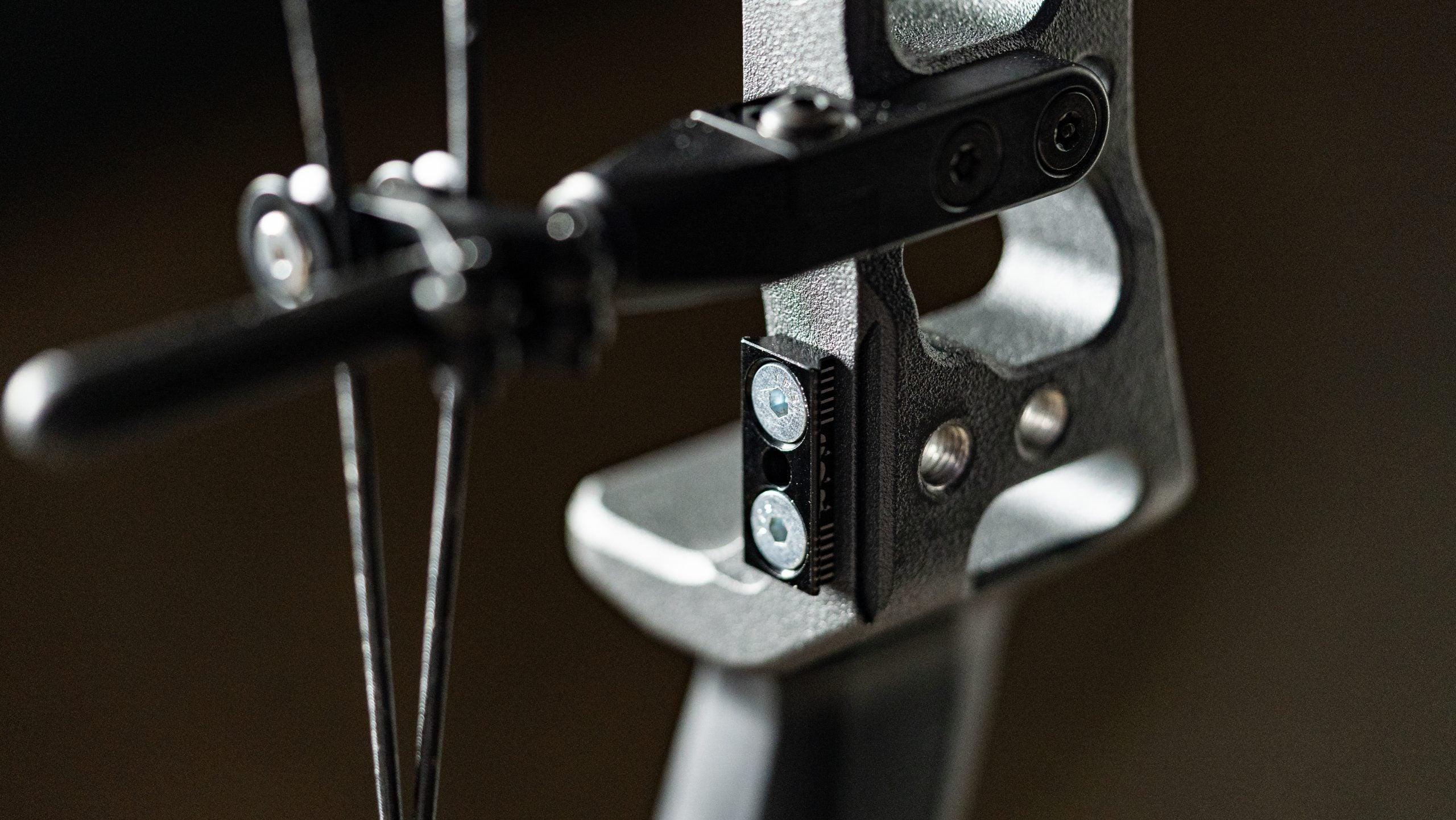 Close-up of Hamskea Archery Epsilon C.O.R. Mount riser interface on bow