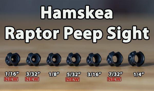 Hamskea Raptor Peep Sight selection with seven sizes on display, black peep sights lined up on a wooden surface.