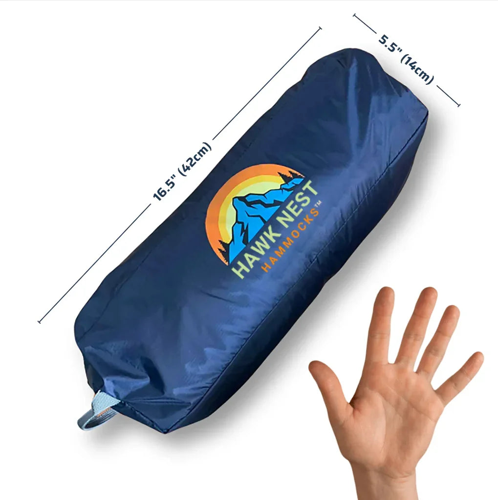Blue Hawk Nest Hammocks bag with logo, size 16.5 x 5.5 inches, next to a hand