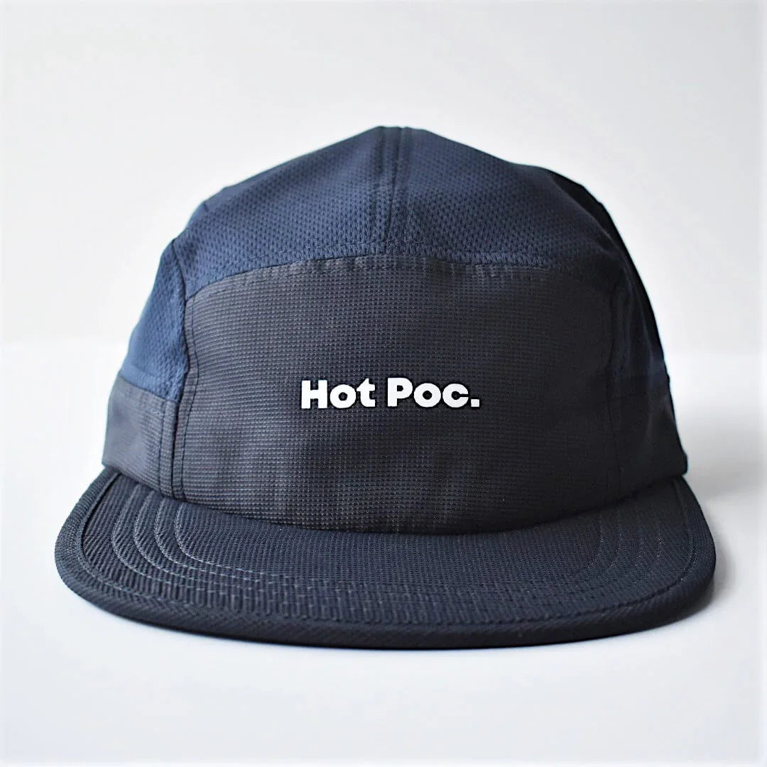 Navy blue cap with 'Hot Poc.' logo on front, flat brim, minimalist style