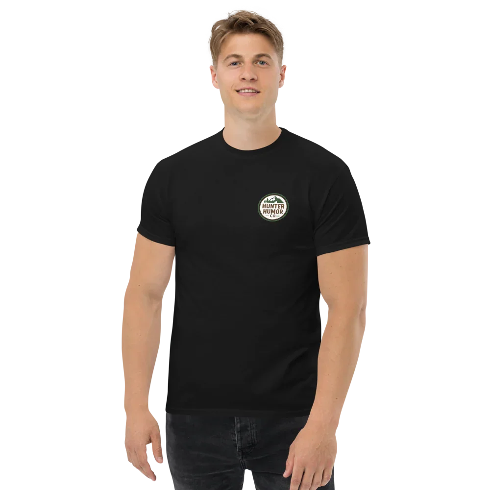 Man wearing a black unisex classic tee with Hunter Humor logo on chest, plain background