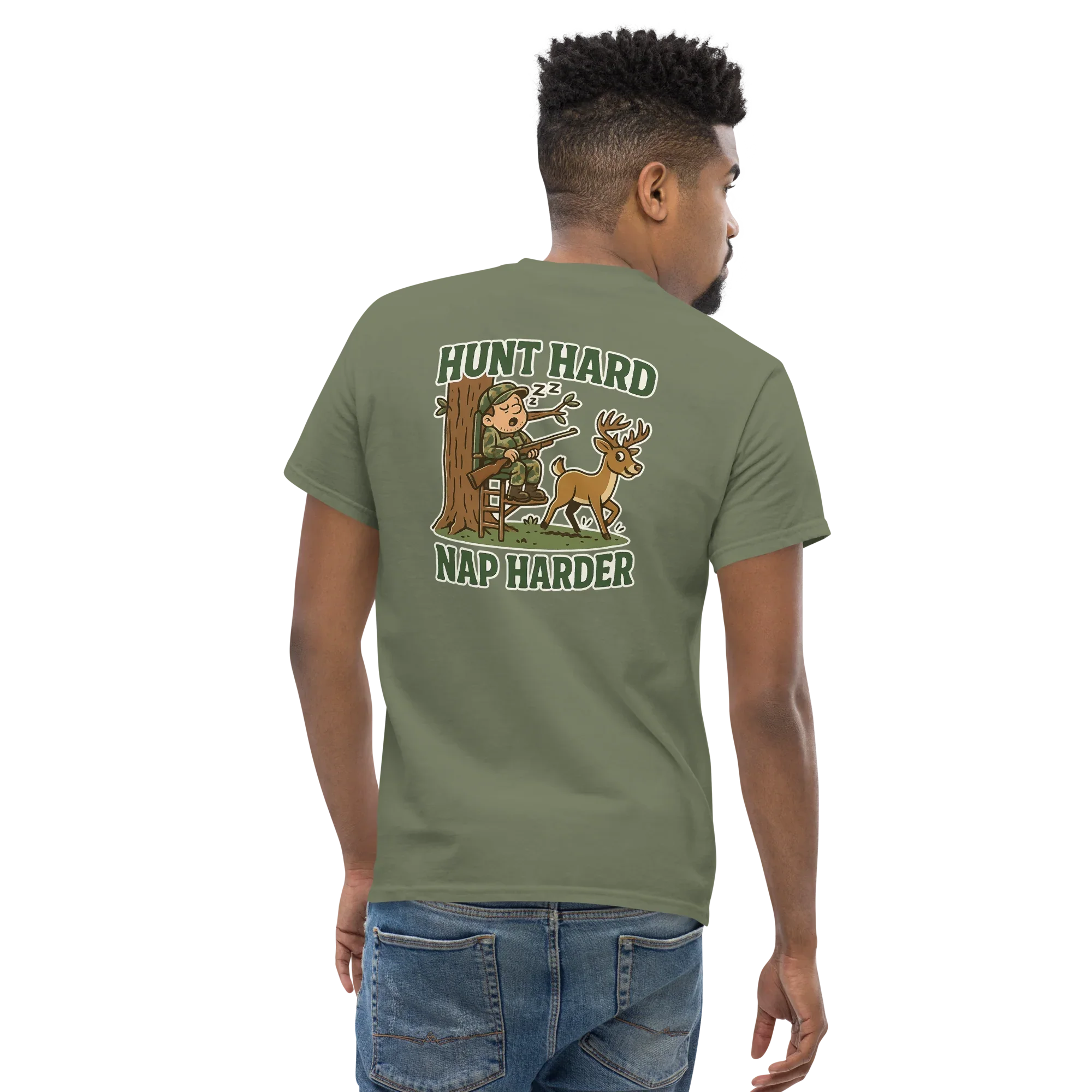 Man wearing military green unisex t-shirt with cartoon deer and hunter graphic, text reads 'Hunt Hard Nap Harder'.