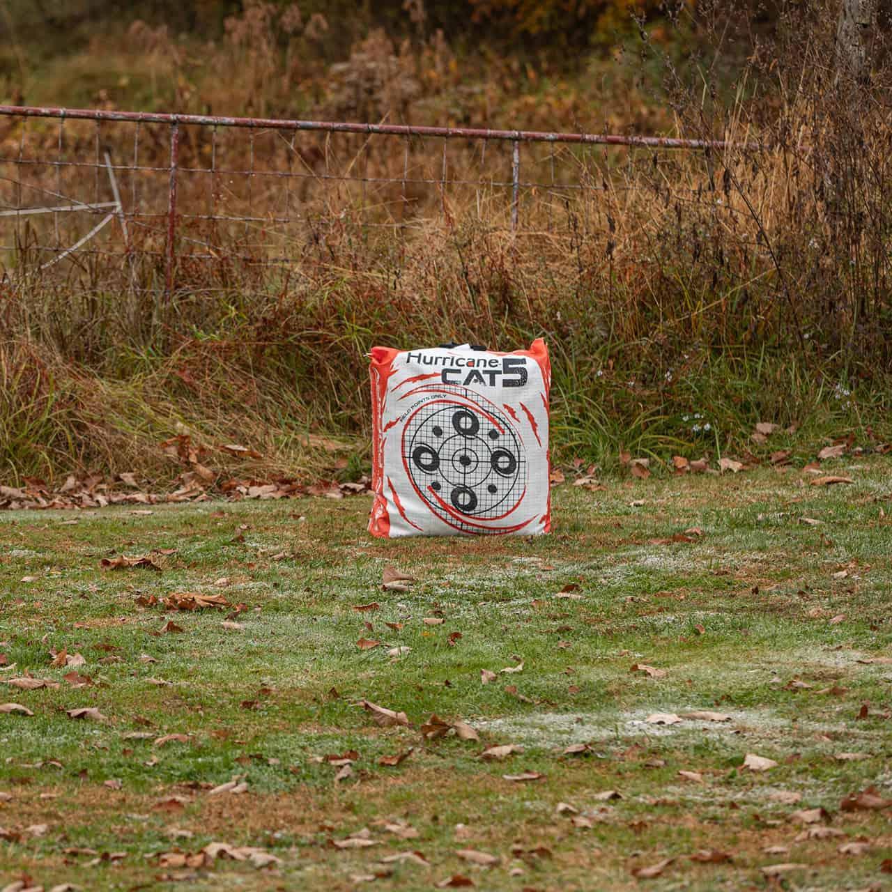 Hurricane Cat 5 archery bag target on grassy field with autumn leaves outdoors