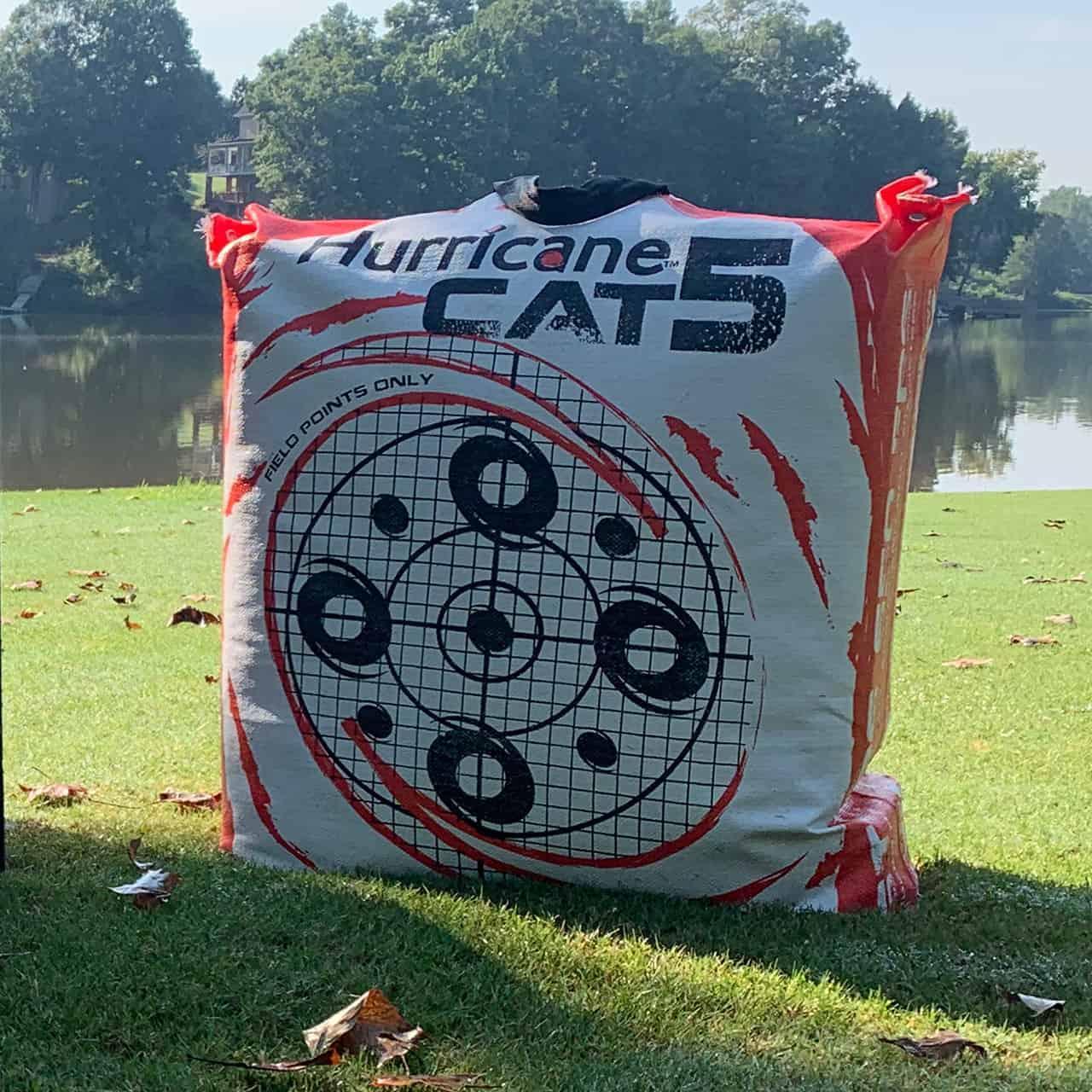 Hurricane CAT 5 archery bag target with bullseye design on grass by a lake outdoors