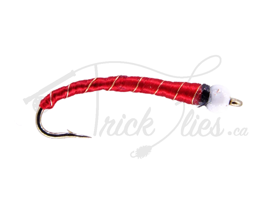 Red and white ice cream cone fishing fly lure with gold hook on white background