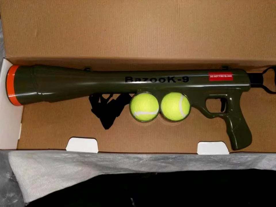 Bazook-9 dog ball launcher gun with two tennis balls in cardboard packaging