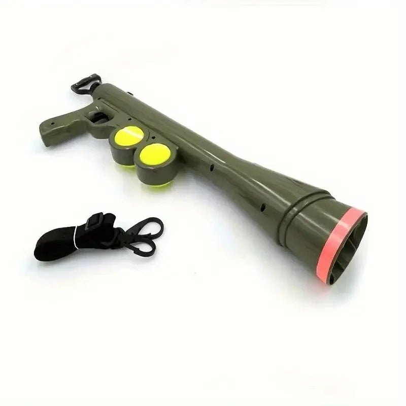 Green plastic ball launcher gun with yellow ball chambers and black strap on white background