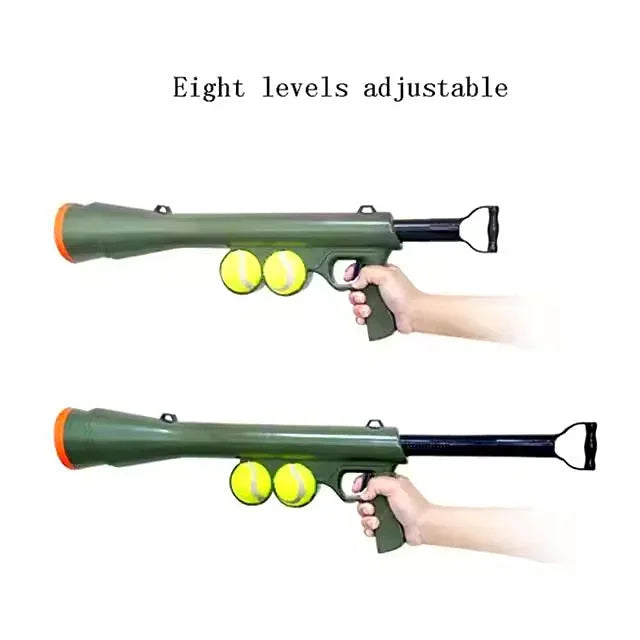 Green adjustable tennis ball launcher gun for dogs, shown with two tennis balls and extendable stock