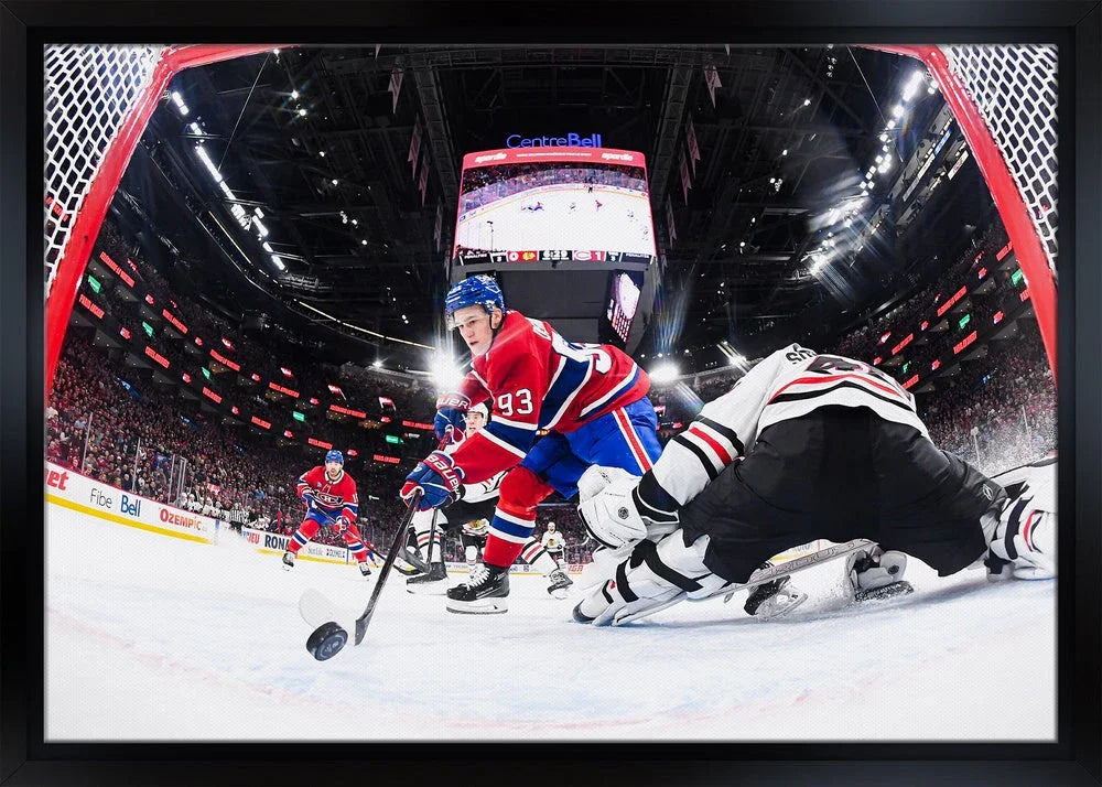 Montreal Canadiens player in red jersey playing hockey near opposing goalie at Centre Bell arena