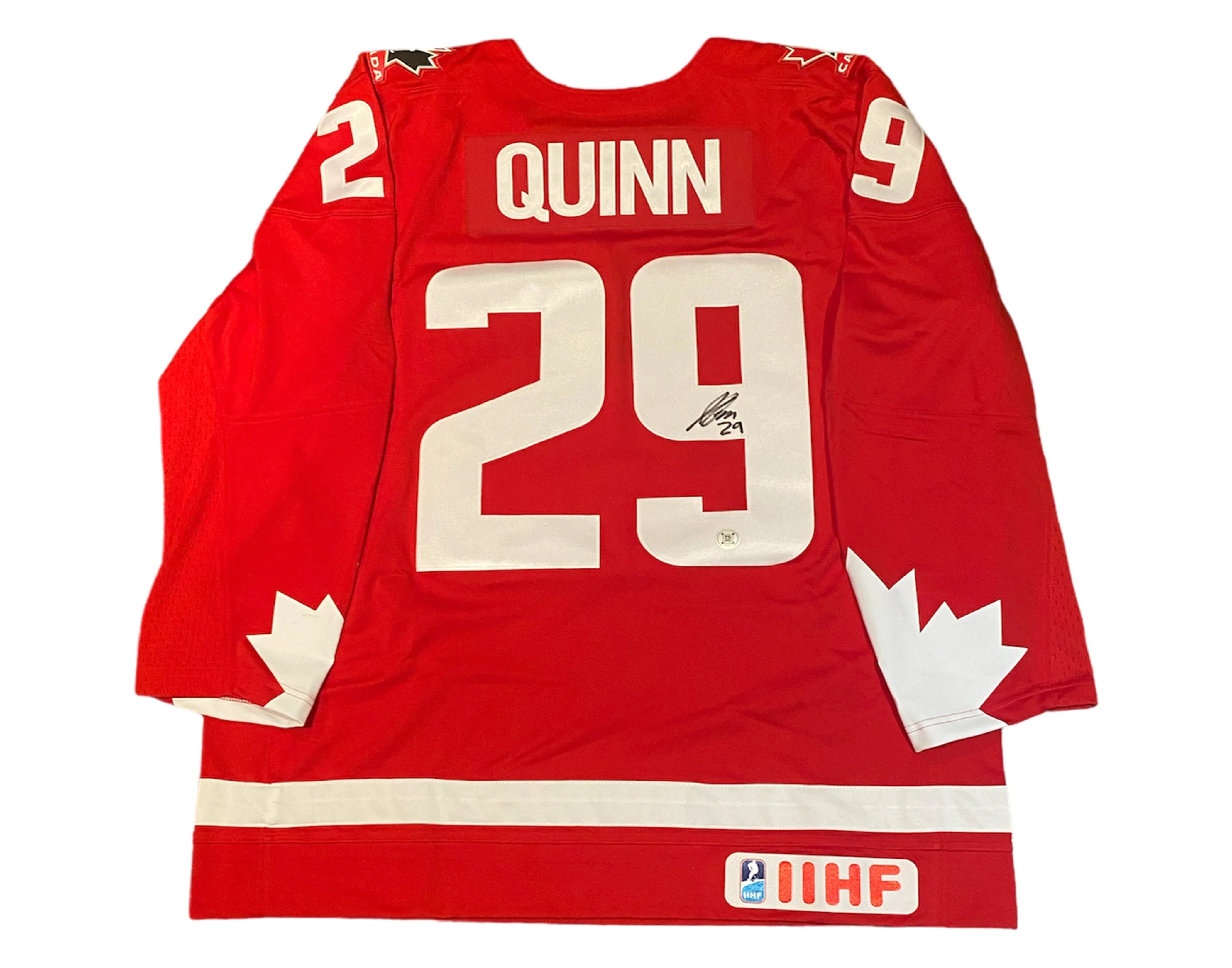 Red Team Canada hockey jersey with Quinn 29, white maple leaf, IIHF patch, and autograph