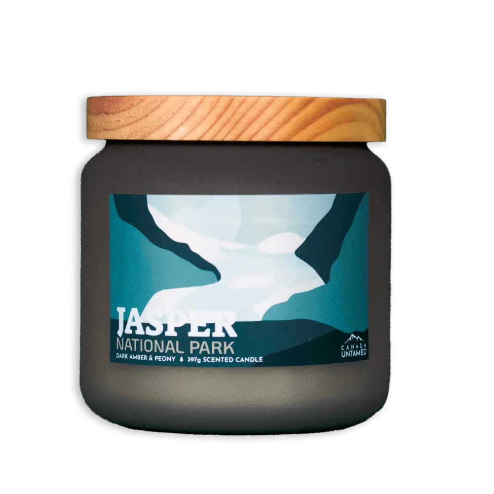 Jasper National Park dark amber peony scented candle in a frosted jar with wood lid