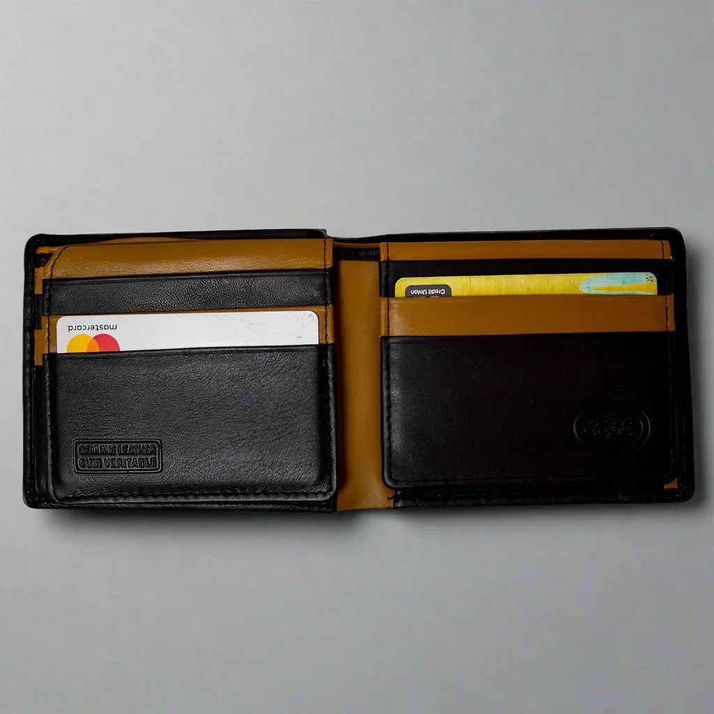 Black and tan leather RFID bifold wallet for men with cards inside, on a gray background