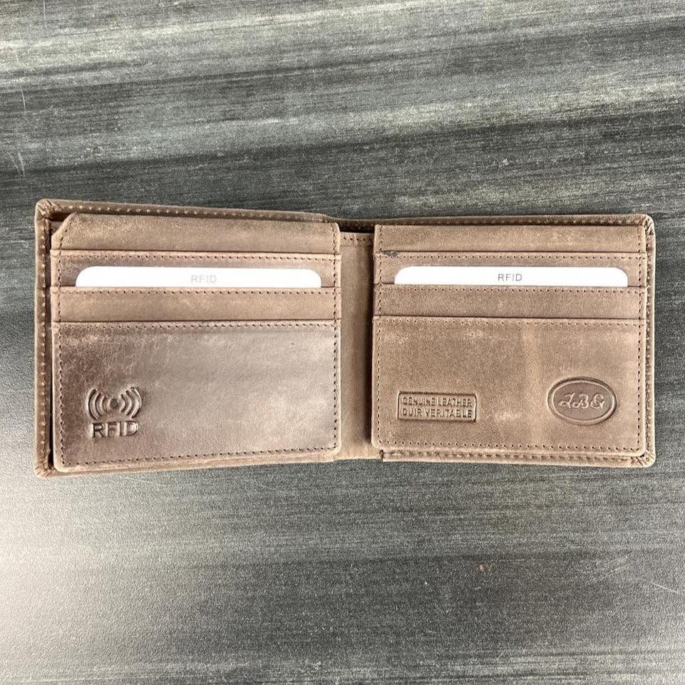 Brown leather RFID wallet open on grey surface, showing card slots and embossed logo.