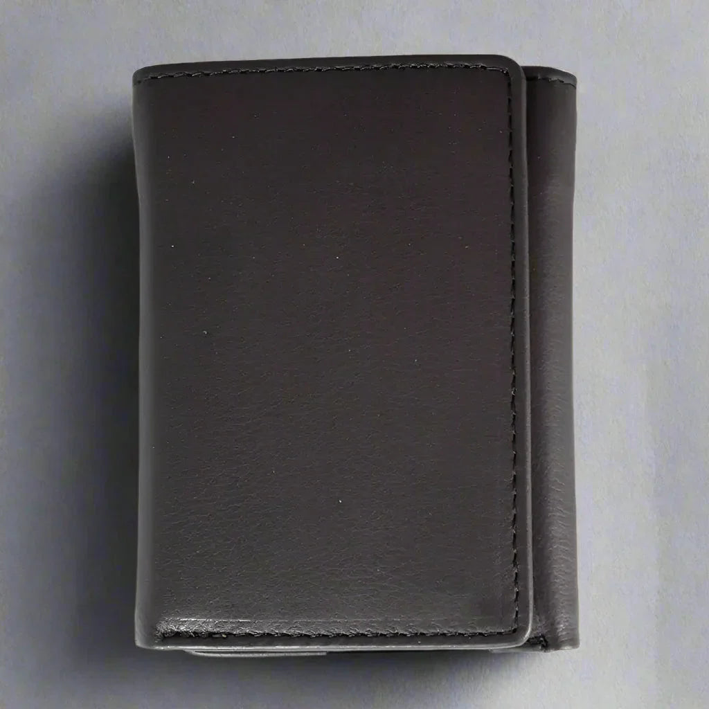 Black leather men's trifold wallet on a light background, minimalist design