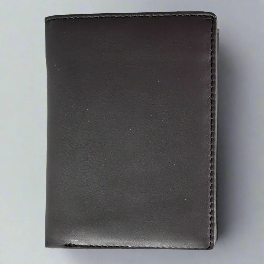 Men's black trifold leather wallet with snap-close design on a light gray background