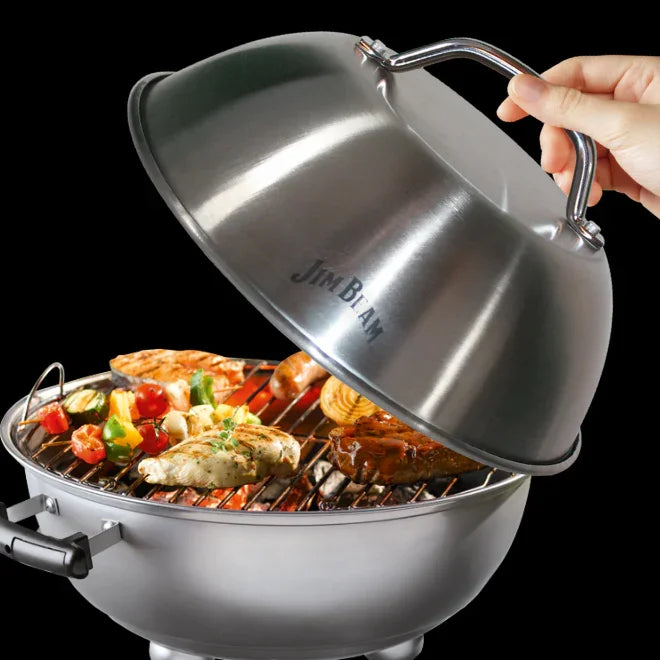 Jim Beam stainless steel grill with assorted meats and vegetables on grate