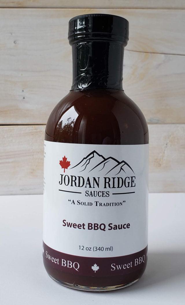 Jordan Ridge Sweet BBQ Sauce 12oz bottle with maple leaf logo on wood background