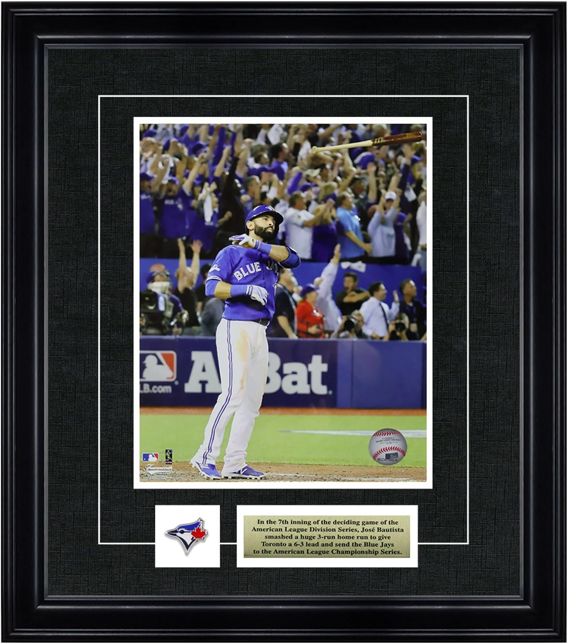 Framed photo of Toronto Blue Jays player bat flipping in stadium during playoff baseball game.