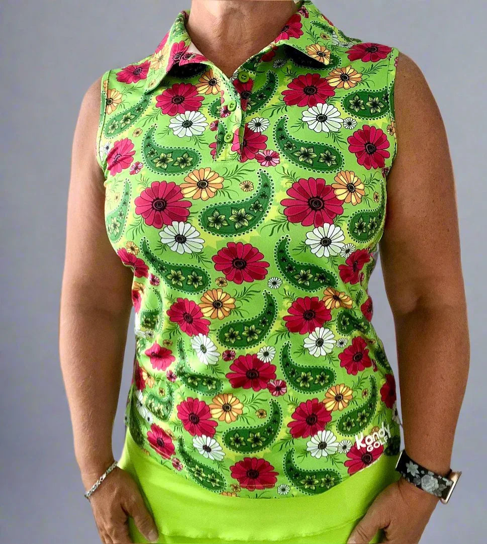 Woman wearing sleeveless green floral paisley golf polo shirt, Kandy Golf brand.