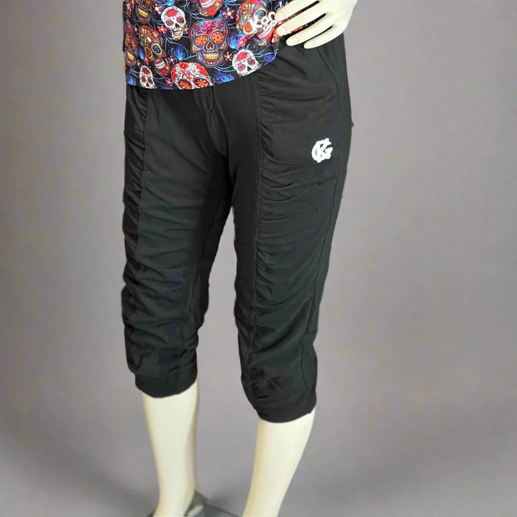 Black ruched capri pants on mannequin, Sugar Skulls shirt, athletic wear