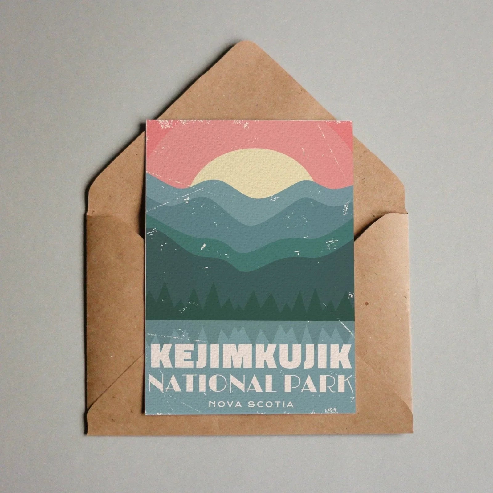 Kejimkujik National Park Nova Scotia postcard with stylized mountains and sunset in envelope